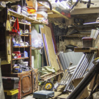 Big mess in an over stuffed suburban garage.